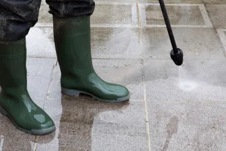 Washing a backyard patio surface