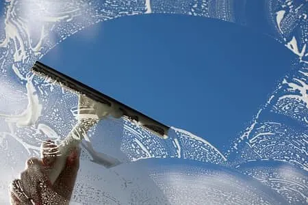 Cleaning exterior windows and screens on a home